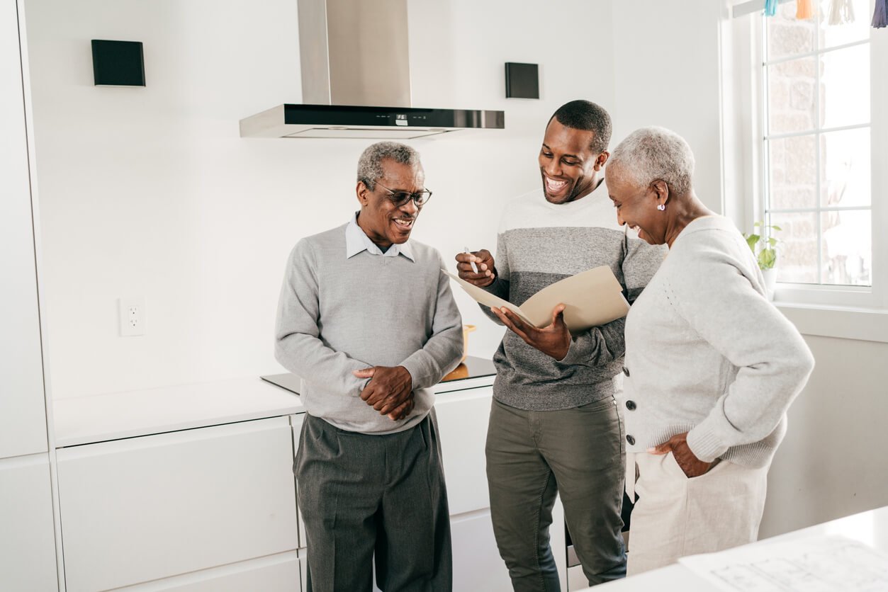 Family happily reviewing inheritance papers