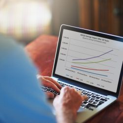 Man managing retirement plan on laptop
